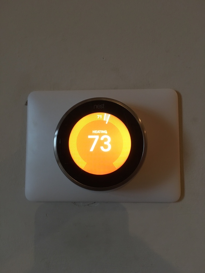 working on Carrier furnace and installing a Nest thermostat  in N Lincoln Ave, Chicago, IL, USA.
